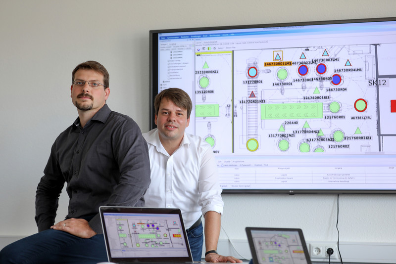 Das Bild zeigt die Geschäftsführer von Coman Software Timur Ripke und Sven Kägebein. 