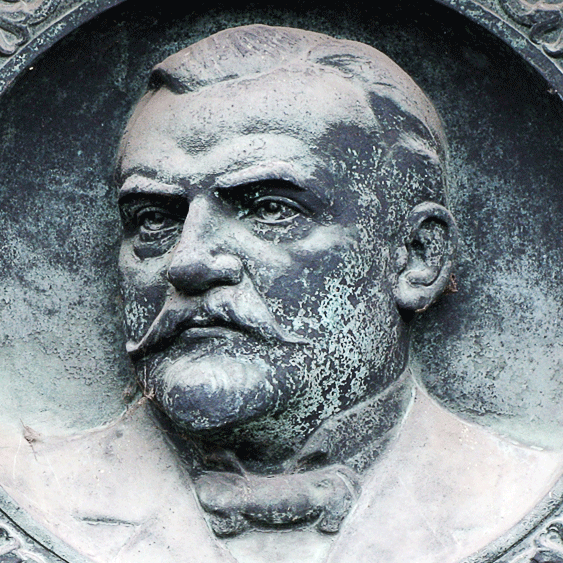 Das Bild zeigt ein Bronzerelief von Constantin Fahlberg am Ehrengrab in Magdeburg.